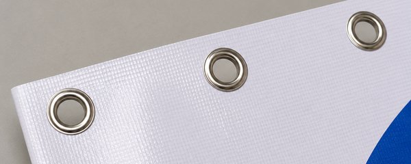 Close-up of metal eyelets along a banner's top edge